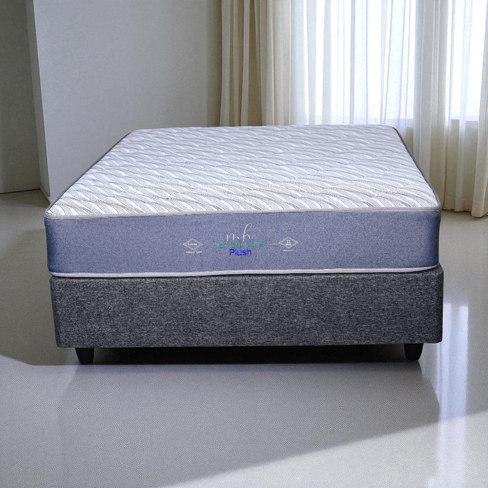 Mattress on a stand with branding in a room setting