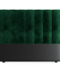 A double size headboard upholstered in emerald green velvet with a black base, presented against a plain background.