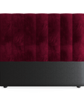 A double-sized headboard upholstered in red velvet, with a smooth, plush surface and a flat base, set against a white background.