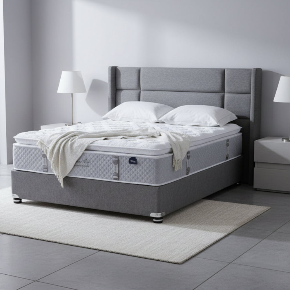 Mattress on a gray platform with a neutral background