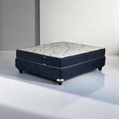 Mattress on a white platform with a neutral background