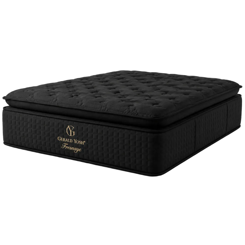 A black quilted mattress with a tufted top surface and a quilted side panel, featuring gold 'Gerald Yost' and 'Freeman' branding on the front, set against a plain white background.