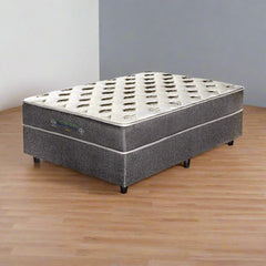 Three quarter size mattress on a white background, showcasing its design and texture.