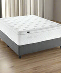 Mattress with gray fabric base on a white background