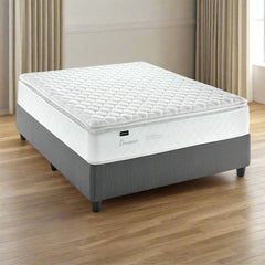 A three quarter bed set with a pillowtop mattress on a gray base, designed for a standard length bed.