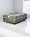 Mattress on a white platform with a plain background