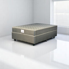 Mattress on a white platform with a plain background