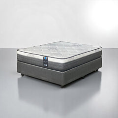 Gray mattress on a gray platform with a white background