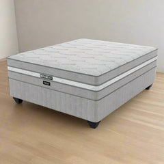 A Restonic branded medium firm three quarter standard length bed set with a pillow top, displayed on a white background.
