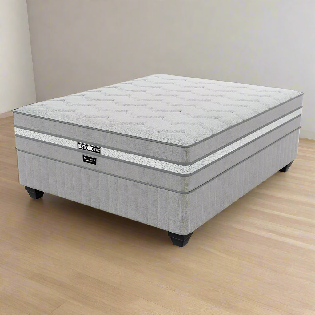 A Restonic branded medium firm three quarter standard length bed set with a pillow top, displayed on a white background.