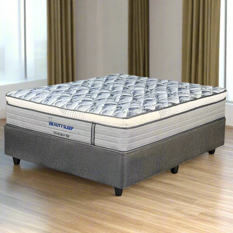 Mattress with 'Beauty Sleep' branding on a white background