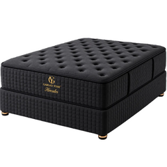 A black tufted mattress on a matching quilted base, branded with a gold logo that reads Garlad Yosh Hercules, shown on a clean white background.