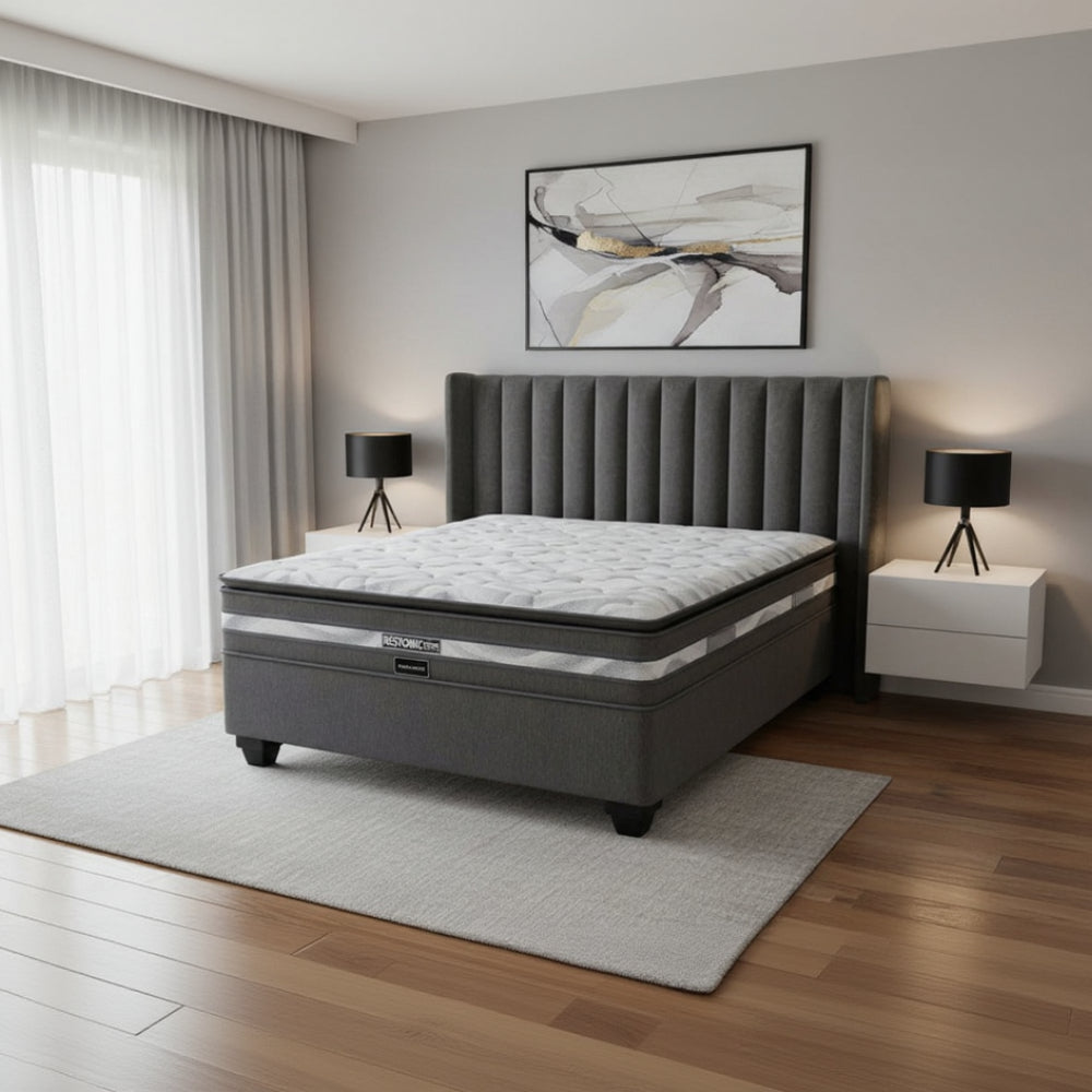 Gray mattress with 'Restonic' branding on a white background