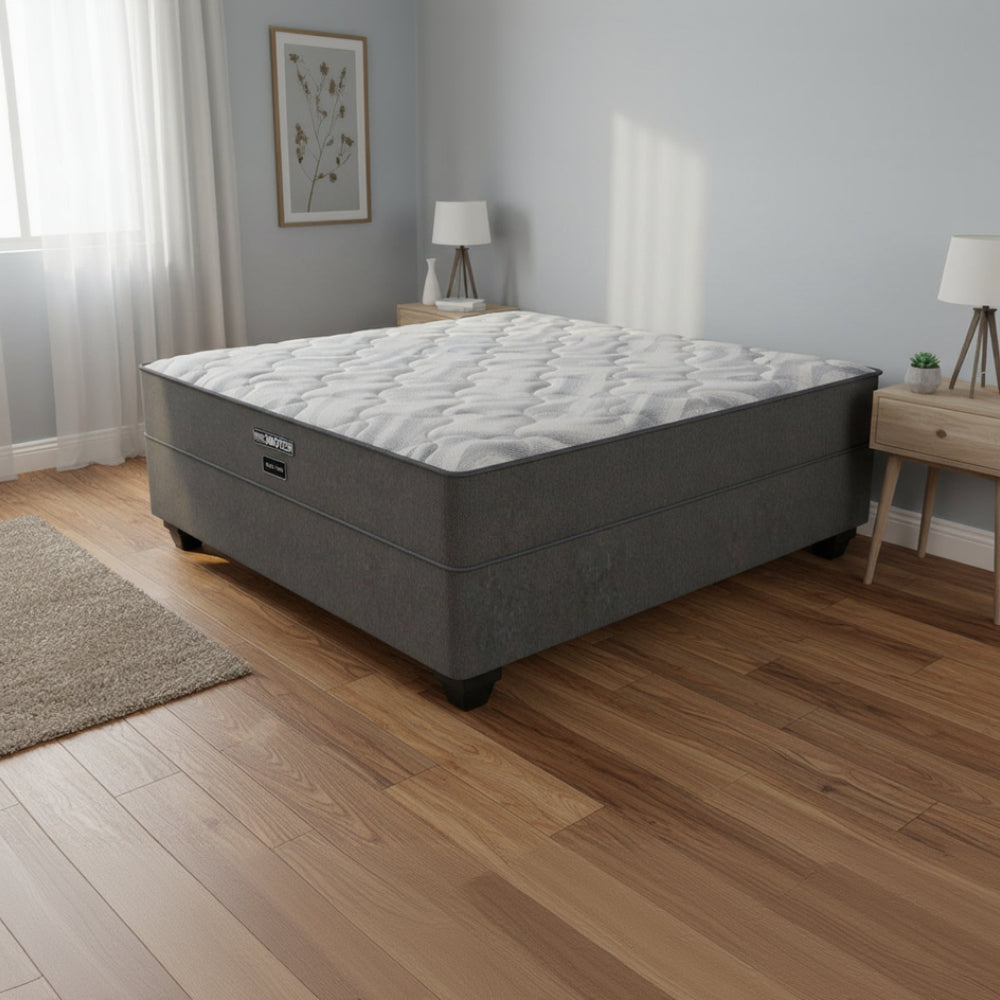 Gray mattress with a textured surface on a white background