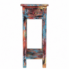 Wooden side table with distressed multicolor finish on a white background