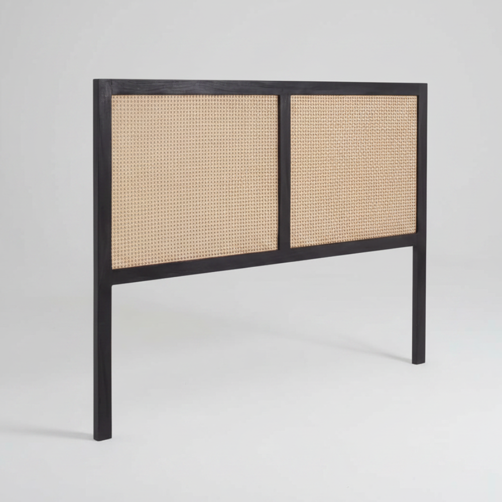 Headboard with black frame and woven natural material on a white background