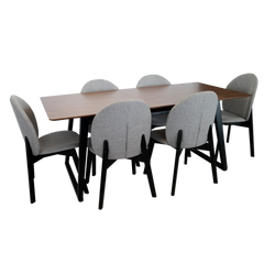 Wooden dining table with six gray chairs on a white background