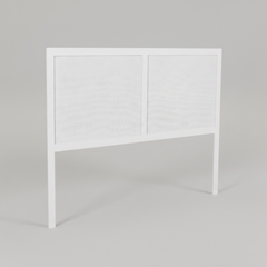 White headboard with wicker design on a black background