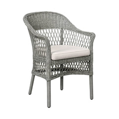 Wicker chair with a white cushion on a white background