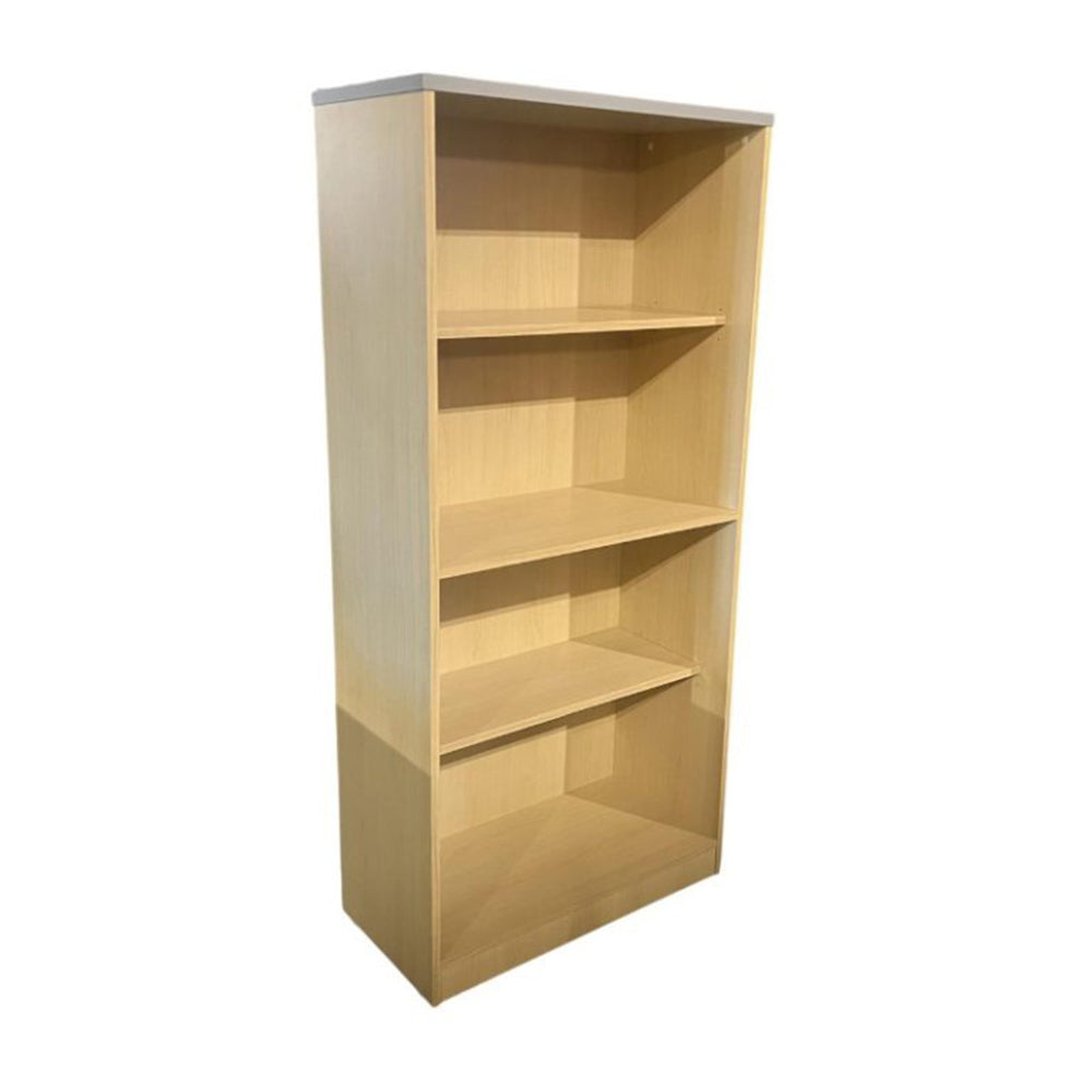 Wooden bookshelf with four shelves on a white background