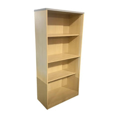 Wooden bookshelf with four shelves on a white background
