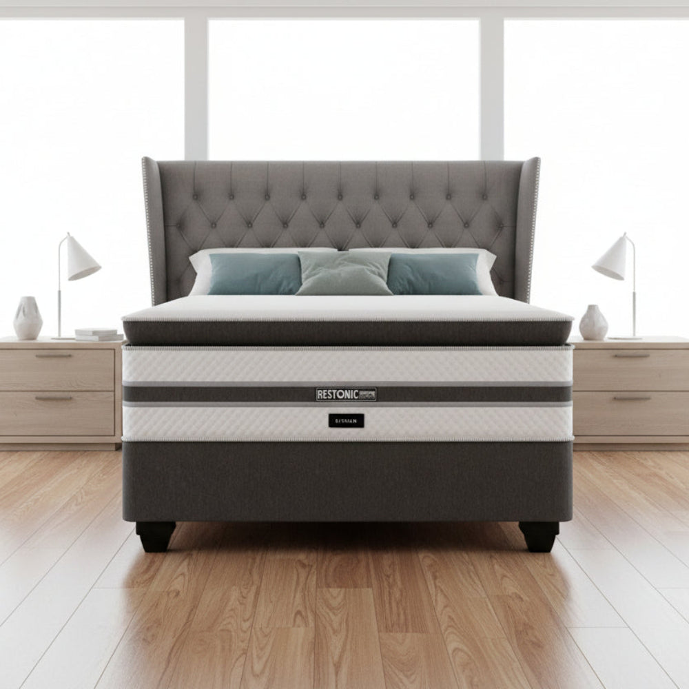 Gray and white mattress with 'Restonic' branding on a white background