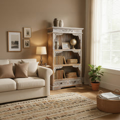 Wooden bookshelf with decorative carvings on a white background
