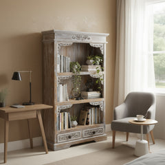 Wooden bookshelf with decorative carvings on a white background