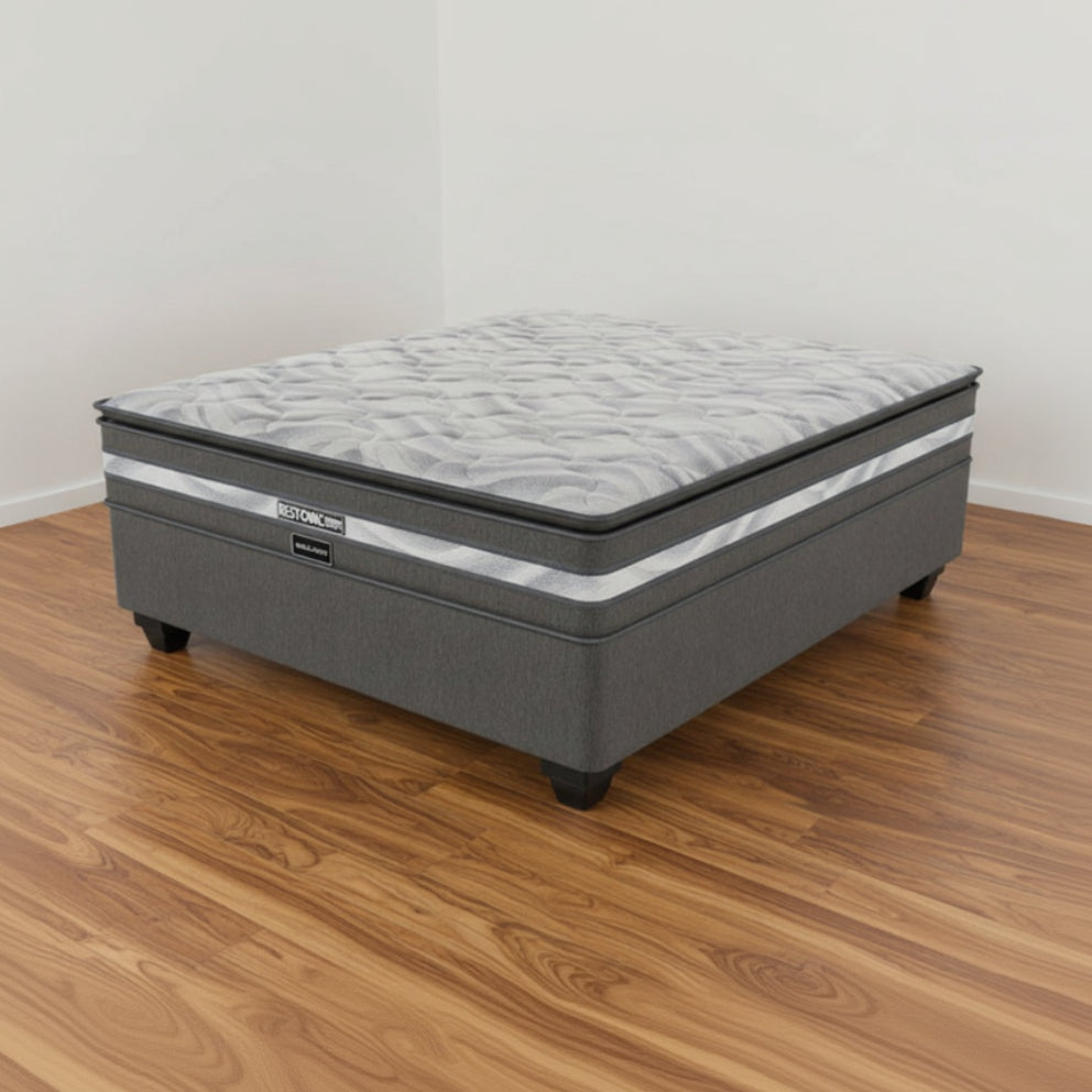 Gray mattress with brand logo on a white background