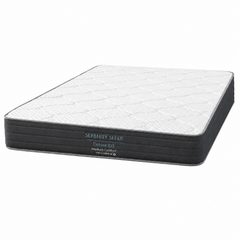 A Serenity Sleep Deluxe XQ medium comfort mattress shown at an angle on a solid white background.