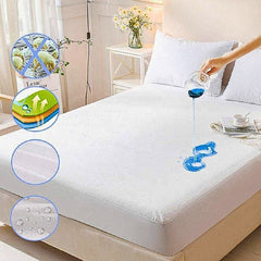 Mattress protector being demonstrated on a bed with water being poured onto it.