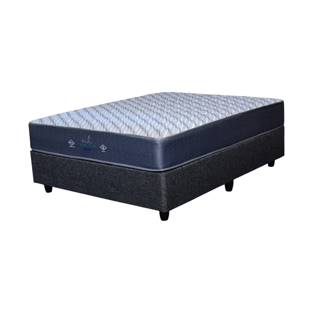 Blue mattress with textured base on a white background